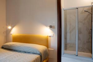 Posteľ alebo postele v izbe v ubytovaní Residenza Cappelli - Case Vacanze