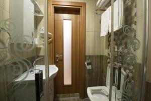 a bathroom with a sink and a toilet at Istanbul Sirkeci Hotel in Istanbul