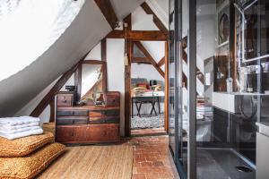 a bathroom with a dresser and a mirror at LA BELLÊME BLEUE in Bellême