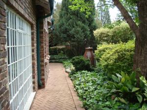 a brick walkway in front of a brick house at Anne's Place in Potchefstroom