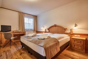 Voodi või voodid majutusasutuse Hotel Marmolada toas