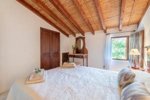 Ein Bett oder Betten in einem Zimmer der Unterkunft Villa Cami de la Mar