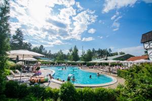 a pool at a resort with people in it at Hotel Selena Family Resort in Cherkasy
