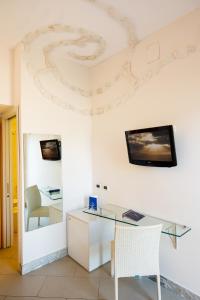 TV a/nebo společenská místnost v ubytování Art Hotel Gran Paradiso