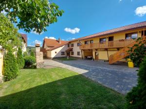 a courtyard of a house with a patio and grass at Casa Simion in Sibiu