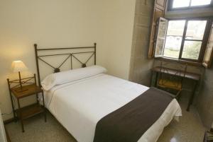 Llit o llits en una habitació de Hospedería San Martín Pinario