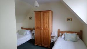 Voodi või voodid majutusasutuse Auld Cross Keys Inn toas