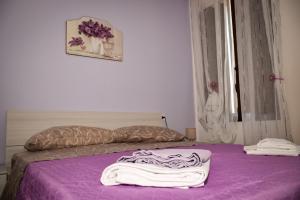A bed or beds in a room at La casa dei Fiori