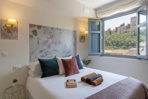 Posteľ alebo postele v izbe v ubytovaní INOLVIDABLES VISTAS a LA ALHAMBRA,