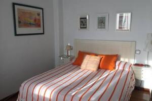 A bed or beds in a room at Espectaculares vistas a la Bahia