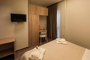 Posteľ alebo postele v izbe v ubytovaní Carpe Diem Rooms