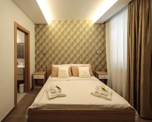 Posteľ alebo postele v izbe v ubytovaní Carpe Diem Rooms