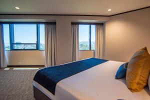Postel nebo postele na pokoji v ubytování Grand Hotel Tijuana