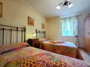 Кровать или кровати в номере Apartamentos Turísticos Rosa