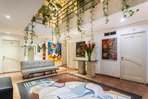 a living room with a couch and a table at Hotel Picasso Inn in Bogotá