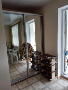 a mirror in a living room with a bunch of drawers at Nautilus in Odesa