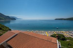 a view of a beach with a large body of water at Poseidon The Beach Hotel in Budva