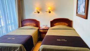 Katil atau katil-katil dalam bilik di Hotel Continental Lima