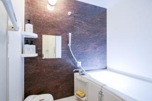 a bathroom with a shower and a toilet in it at Room 301 - Vacation STAY 86506 in Fukuoka
