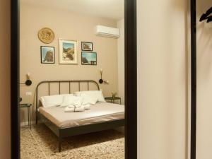 Letto o letti in una camera di Four Rooms Alghero
