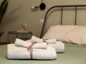 Letto o letti in una camera di Four Rooms Alghero