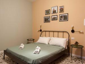 Letto o letti in una camera di Four Rooms Alghero