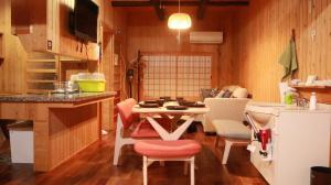 a kitchen with a table and chairs in a room at Nagoya - House - Vacation STAY 7563 in Nagoya