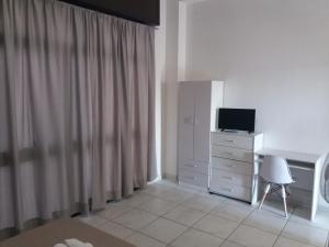 A television and/or entertainment centre at B&b il Girasole