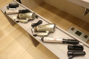 a table with a hair dryer and other items on it at 2nd floor of 3rd NEO building - Vacation STAY 88300 in Sapporo