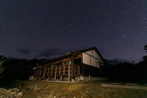 a building under a starry sky at night at Kumage-gun - House - Vacation STAY 84975 in Yudomari