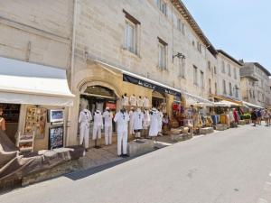 a group of mannequins standing in front of a store at Holiday Home in Avignon next to the City Centre in Avignon