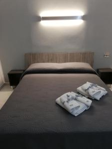 Postel nebo postele na pokoji v ubytování B&b regina del porto