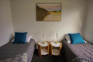 Voodi või voodid majutusasutuse Nugget View Kaka Point Motels toas