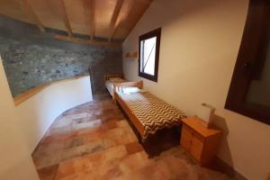 Posteľ alebo postele v izbe v ubytovaní Casa del Pont