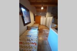 Posteľ alebo postele v izbe v ubytovaní Casa del Pont