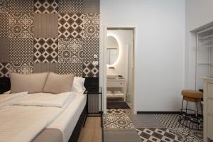 Posteľ alebo postele v izbe v ubytovaní Aborda Rooms