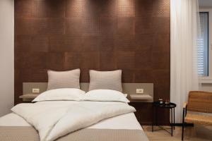 Posteľ alebo postele v izbe v ubytovaní Aborda Rooms