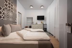 Posteľ alebo postele v izbe v ubytovaní Aborda Rooms