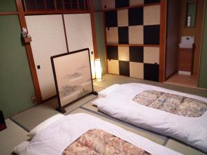 Postel nebo postele na pokoji v ubytování Kyoto Villa Kotone + 30 fotografií