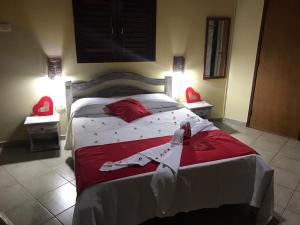 Cama ou camas em um quarto em Pousada Hibiscus