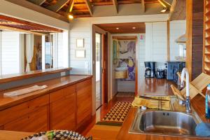 a kitchen with a sink and a counter at Villa Oona in Maharepa