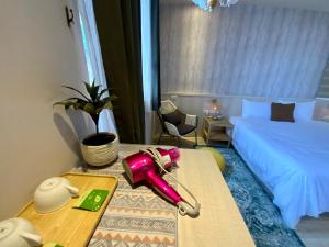 Postel nebo postele na pokoji v ubytování 茉白電梯民宿Bed and Breakfast Elevator 花蓮夜市電梯包棟