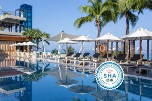 a pool at the shka resort and spa at Cape Sienna Phuket Gourmet Hotel & Villas - SHA Extra Plus in Kamala Beach