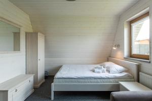 Letto o letti in una camera di Tuhamäe hosteli puhkemajad