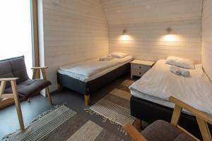 Letto o letti in una camera di Tuhamäe hosteli puhkemajad