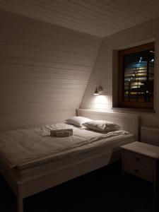 Letto o letti in una camera di Tuhamäe hosteli puhkemajad