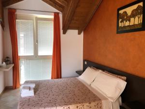 Ένα ή περισσότερα κρεβάτια σε δωμάτιο στο La Siesta Bed&Residence