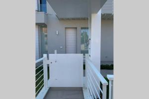 a hallway of a house with a white door at da Nonna Lidia in Fano