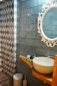a bathroom with a sink and a mirror at kartalia studios in Porto Koufo
