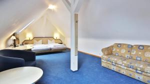 Postel nebo postele na pokoji v ubytování Altstadt Hotel
